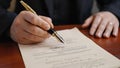Businessman Signing Official Document With Fountain Pen. Legal Agreement Concept Royalty Free Stock Photo