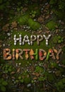 Forest floor leaves and stones forming \'Happy Birthday\' â eco nature greeting Royalty Free Stock Photo