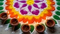 Vibrant Flower Rangoli with Circle of Diyas Royalty Free Stock Photo