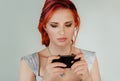 Upsed woman texting .red hair