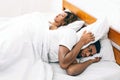 Tired and annoyed man of his girlfriend snoring Royalty Free Stock Photo