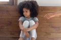 Offended biracial small girl feel hurt ignoring parent