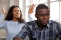 Upset african husband feels disappointed in love ignoring angry Royalty Free Stock Photo