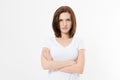 Upset and angry girl in white blank t shirt isolated on white background. Sad and mad woman with crossed arms . Copy space