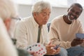 Upset asian man playing cards with Royalty Free Stock Photo