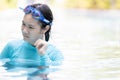 Upset asian teen girl had tinnitus,problem with water entering the ear canal while swimming,female people cleaning ears after