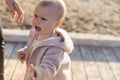 Upset baby girl standing near father on beach,stock image Royalty Free Stock Photo