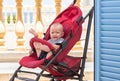 Upset baby in pram Royalty Free Stock Photo