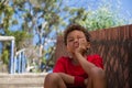 Upset boy sitting on staircase in the boot camp Royalty Free Stock Photo