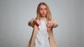 Upset business woman girl in suit showing thumbs down sign gesture, disapproval dissatisfied dislike Royalty Free Stock Photo