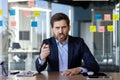 Angry businessman pointing during a video call in office Royalty Free Stock Photo