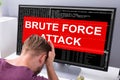 Upset Businessman Looking Brute Force Attack On Computer Screen