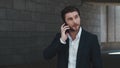 Businessman talking on cellphone at street. Business man calling on phone Royalty Free Stock Photo