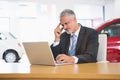 Upset businessman working on computer