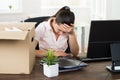 Upset Businesswoman Sitting At Desk Royalty Free Stock Photo