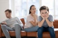 Upset child boy looking at camera sad about parents fights Royalty Free Stock Photo