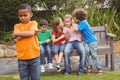 Upset child standing away from group