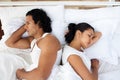 Upset couple in bed sleeping separately Royalty Free Stock Photo