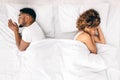 Upset couple sleeping separately on their bed Royalty Free Stock Photo