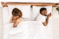 Upset couple sleeping separately on their bed Royalty Free Stock Photo
