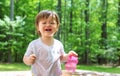 Upset toddler boy playing with water Royalty Free Stock Photo