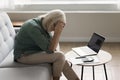 Upset depressed older woman finding bankruptcy, overspending