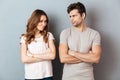Upset disappointed couple standing with arms Royalty Free Stock Photo