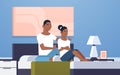 Upset disappointed girlfriend feels offended african american couple sitting in bed worried bad relationship problem Royalty Free Stock Photo