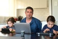 Upset displaced father forced to work from home as the pandemic coronavirus COVID-19 forces many employees to work from home