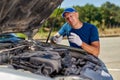 Upset driver man in front of old automobile crash car collision accident in city road Royalty Free Stock Photo