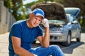 Upset driver man in front of old automobile crash car collision accident in city road Royalty Free Stock Photo