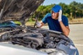 Upset driver man in front of old automobile crash car collision accident in city road Royalty Free Stock Photo