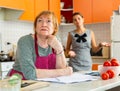 Upset elderly mother with dissatisfied adult daughter