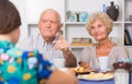 Upset elderly pair having tough talk with girl