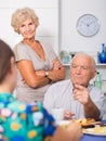 Upset elderly pair having tough talk with girl
