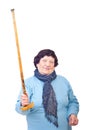 Upset elderly woman showing her stick