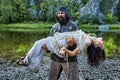 Upset farmer with a woman in her arms