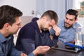 Upset friends talking on couch