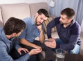 Upset friends talking on couch Royalty Free Stock Photo