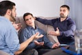 Upset friends talking on couch Royalty Free Stock Photo