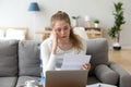 Upset frustrated girl reading bad news in paper letter Royalty Free Stock Photo