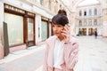 Upset girl receiving bad news while talking on mobile phone Royalty Free Stock Photo