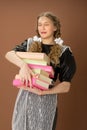 Upset girl in school uniform holding heavy books Royalty Free Stock Photo