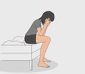 Upset girl. The woman sits on the edge of the bed and holds onto her head, a girl has a headache Royalty Free Stock Photo