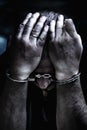 Upset handcuffed man imprisoned for crime, punished for serious villainy. Arrest, gangster, pain concept. Selective focus on face