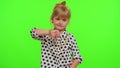 Upset kid child girl showing thumbs down sign gesture, expressing discontent, disapproval, dislike Royalty Free Stock Photo