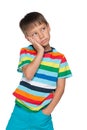 Upset little boy in a striped shirt Royalty Free Stock Photo