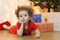 Upset little girl waiting for a surprise. no christmas gifts for baby. Royalty Free Stock Photo