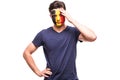 Upset loser fan support of Belgium national team with painted face isolated on white background Royalty Free Stock Photo