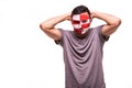 Upset loser fan support of Croatia national team with painted face isolated on white background